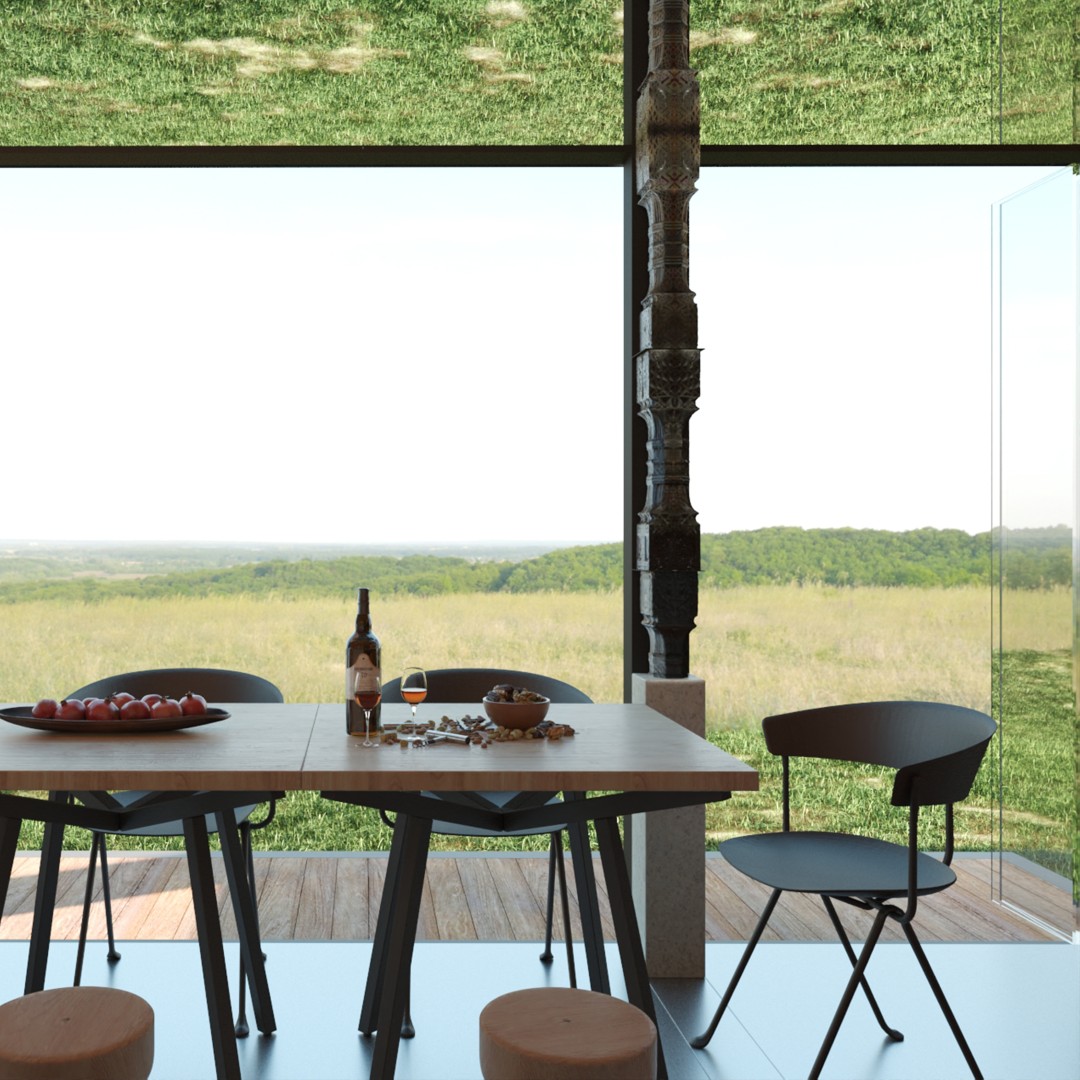 Winebar MD — masă de lemn cu scaune negre, lângă stâlpul sculptat cu motive tradiționale și vitrajul spre câmp